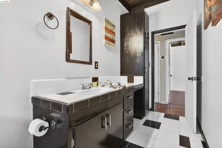 Bathroom with vanity and light tile patterned flooring