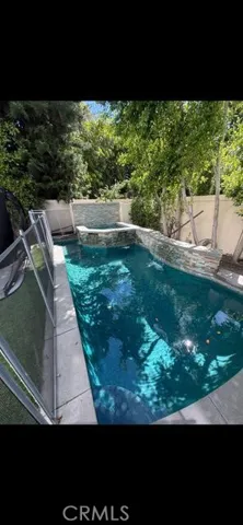 Swimming pool with spa