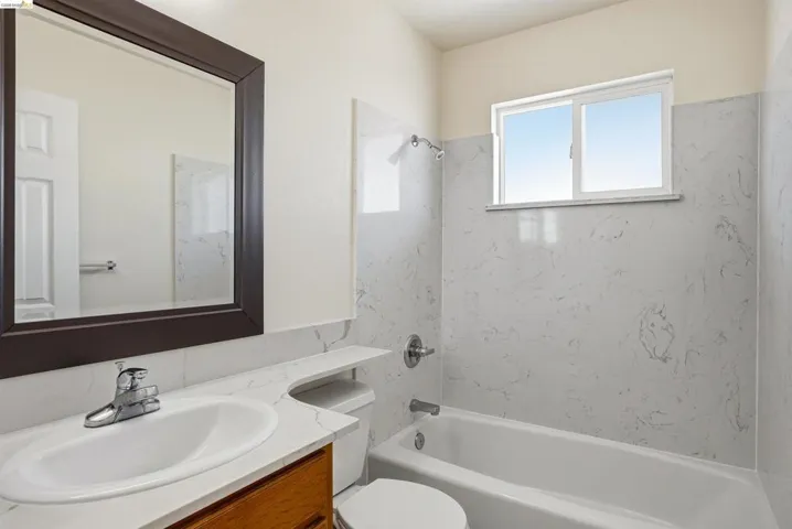 Full bathroom featuring vanity and tub / shower combination