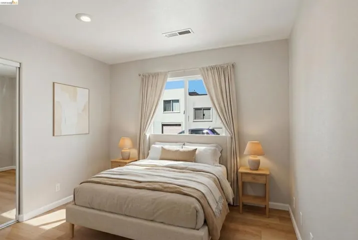 Bedroom featuring light wood finished floors and recessed lighting