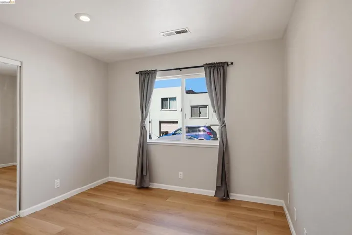 Unfurnished room featuring light wood finished floors and recessed lighting