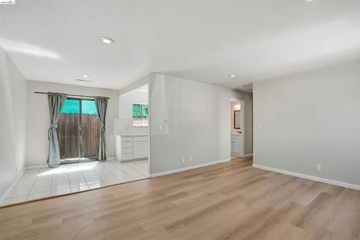 Spare room with light wood-type flooring and recessed lighting