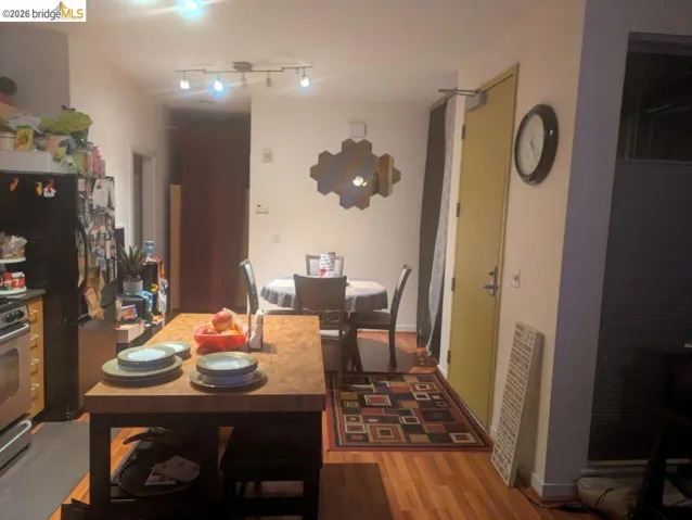 Dining room featuring light wood finished floors and baseboards