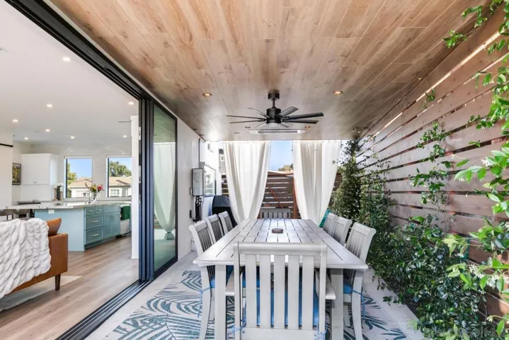 Covered outdoor patio with heaters, lights & ceiling fan