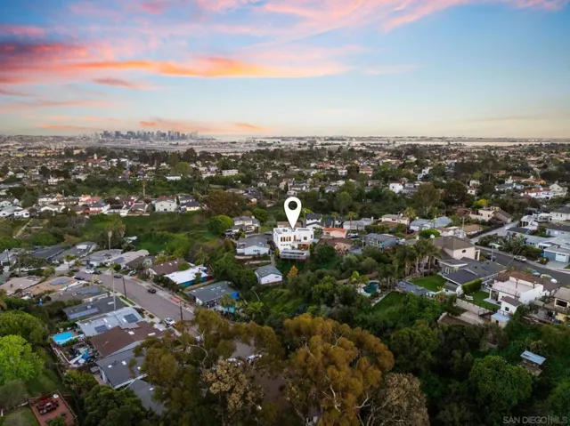 Aerial view of house backing up to canyon