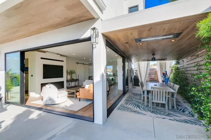 Covered outdoor patio with heaters, lights & ceiling fan