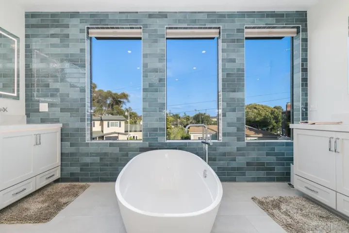 Primary Bathroom with soaking tub, rain shower & dual vanities!