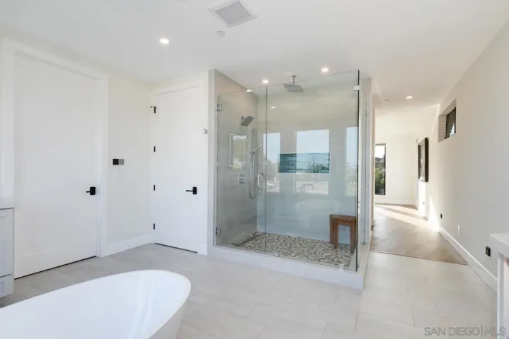 Primary Bathroom with soaking tub, rain shower & dual vanities!