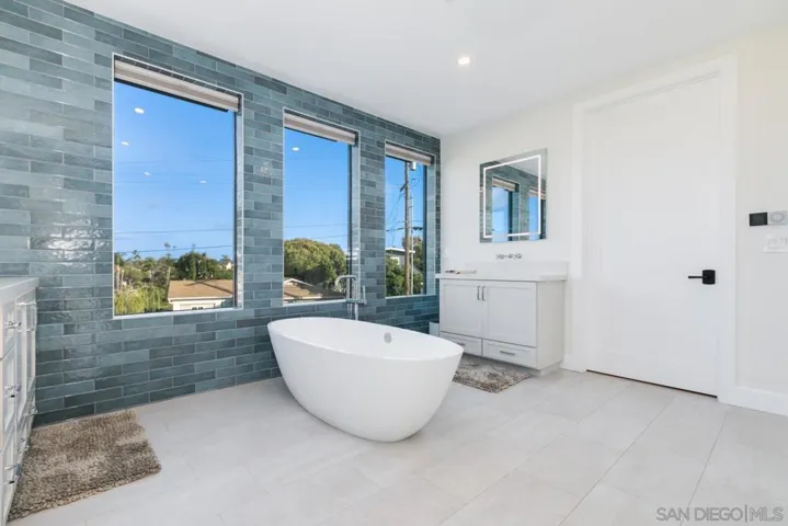 Primary Bathroom with soaking tub, rain shower & dual vanities!