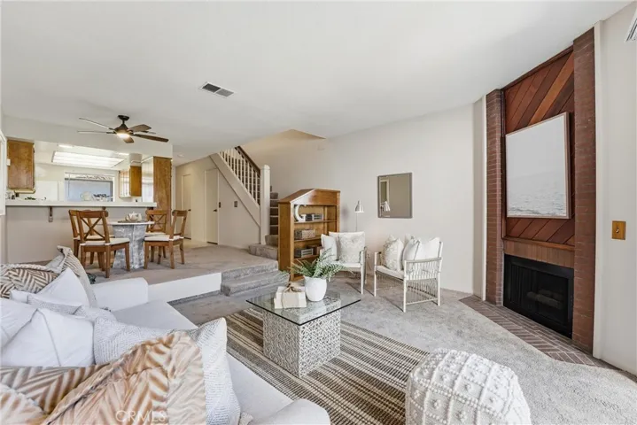 Another view of the living area and the stairs to the second floor