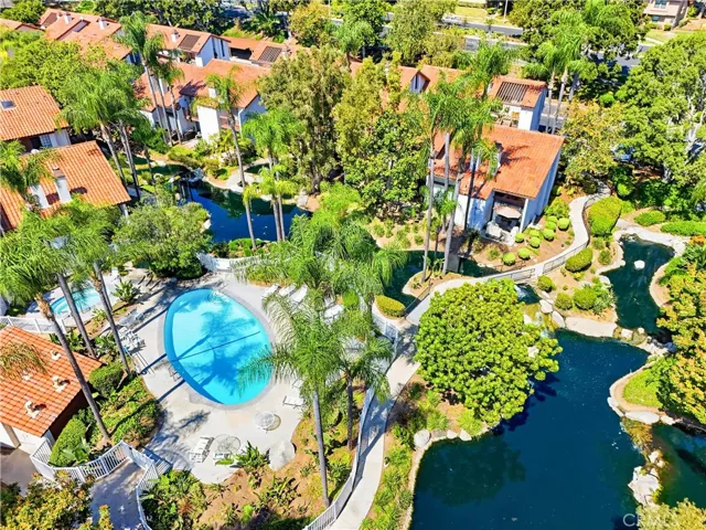 Pool and Spa surrounded by lush tropical landscaping, offering relaxing retreat just steps from home