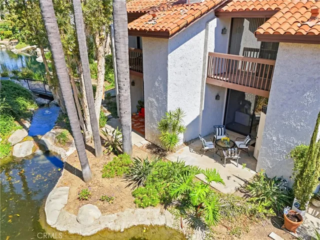Relax on your private Lanai along tranquil stream with lush landscaping
