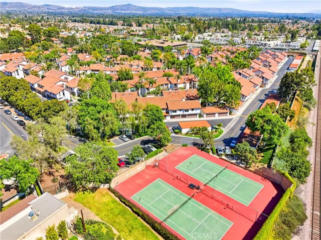 Tennis courts beautifully maintained offering convenient recreation with scenic surrounding views.
