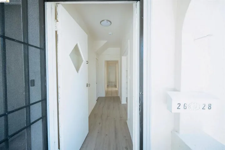Corridor with light wood finished floors