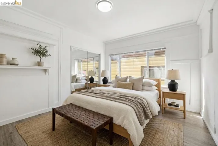 Bedroom with a closet and wood finished floors