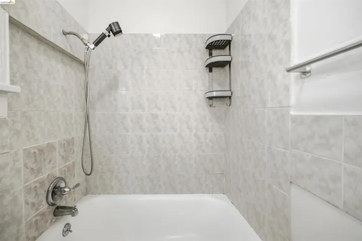 Bathroom with shower / washtub combination