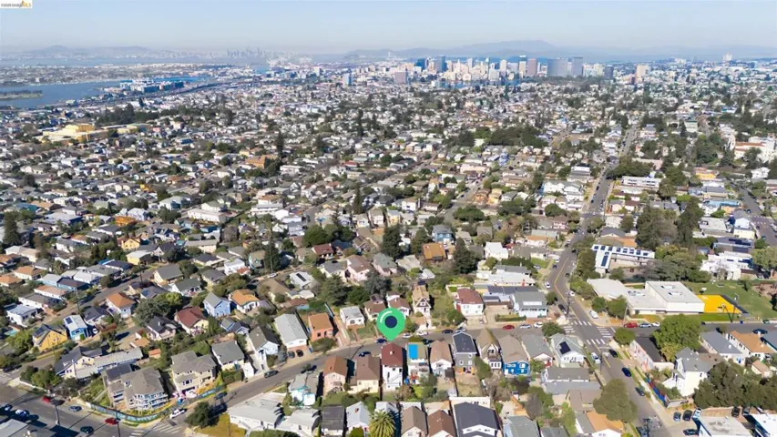 Aerial view of property's location with nearby suburban area