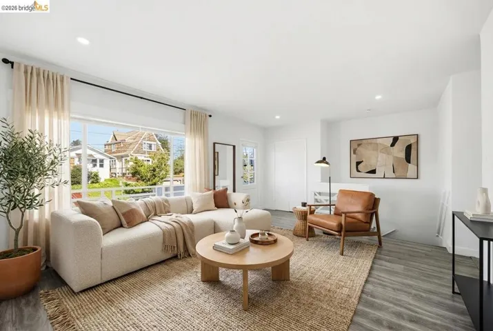 Living area featuring wood finished floors and recessed lighting