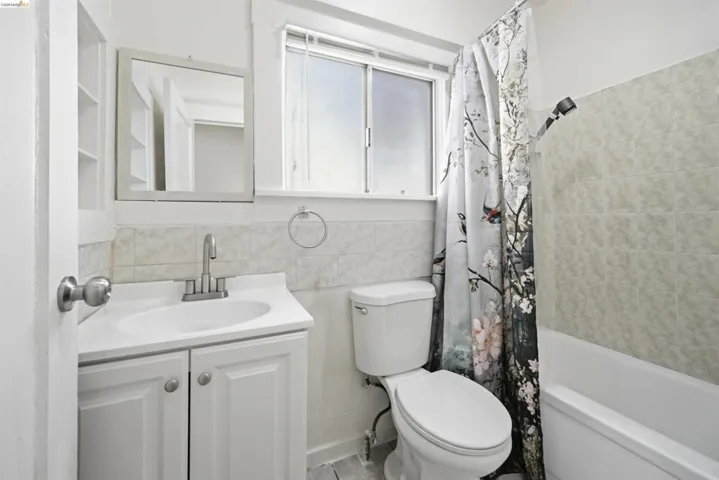 Full bathroom with vanity and shower / tub combo
