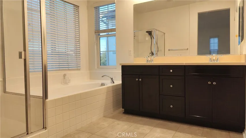 Master bathroom with separate shower and tub