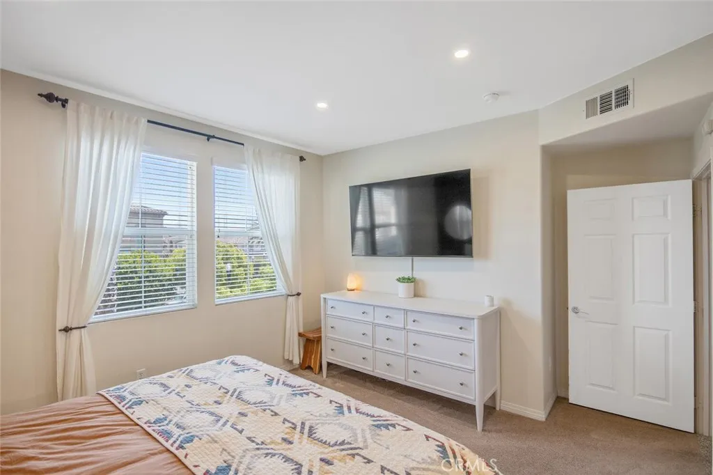 Bedroom 1 (Primary) with view of trees and mountains