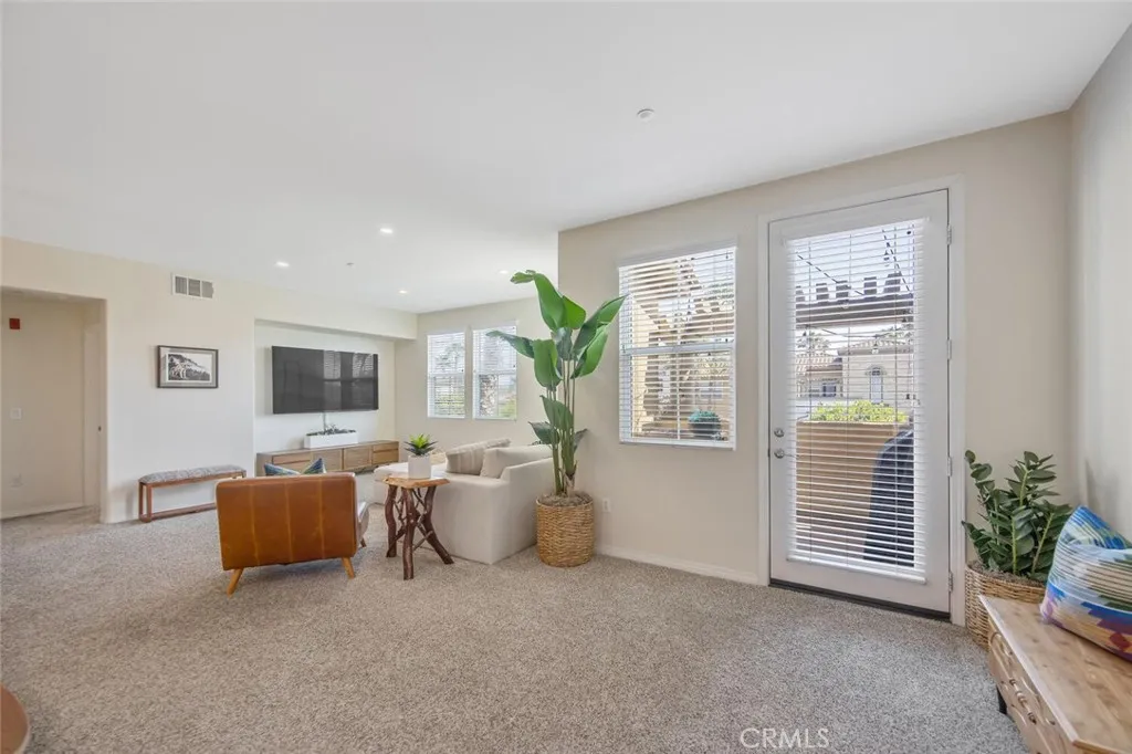 Living room has private balcony beyond the door on the right