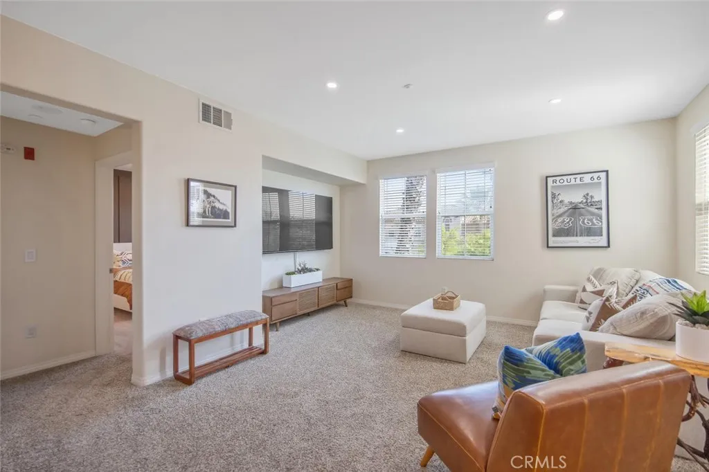 To the left of the living room is the primary bedroom