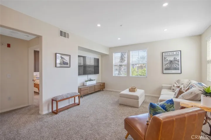 To the left of the living room is the primary bedroom