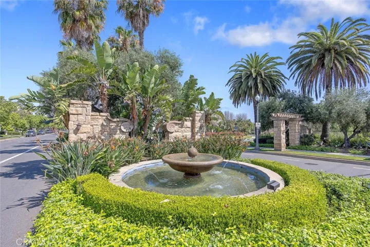 Palms and fountain greet you at the entrance to Village at the Park
