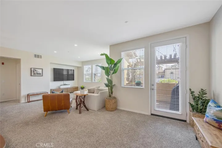 Living room has private balcony beyond the door on the right