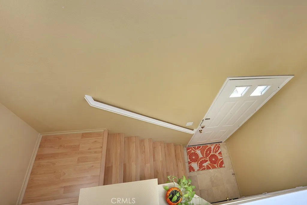 Let’s head downstairs to the foyer with direct access to the garage.