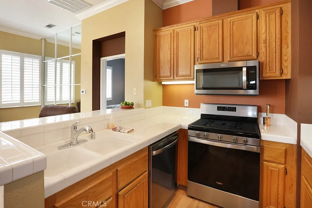 Newer free standing gas range, vented microwave and dishwasher, all stainless steel.