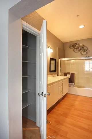 A nice shelved linen closet.