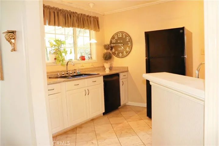 TONS OF KITCHEN STORAGE W/PANTRY ON LEFT