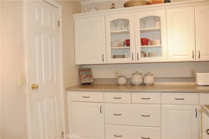 TONS OF KITCHEN STORAGE W/PANTRY ON LEFT