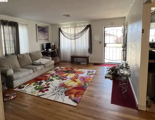 Living area featuring wood finished floors and baseboards