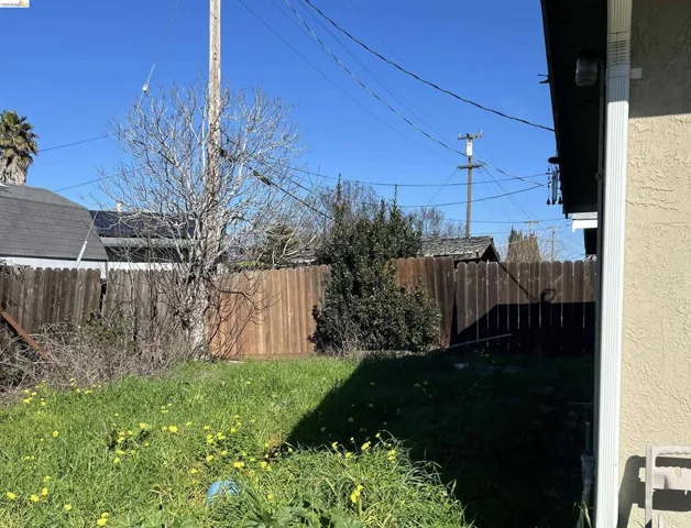 View of fenced backyard