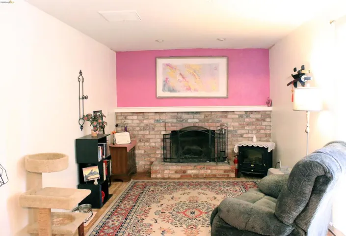 Living room featuring a fireplace and wood finished floors