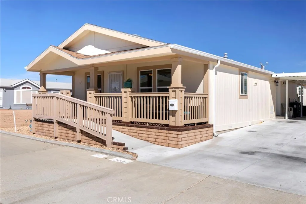 Charming exterior with front porch. Ramp