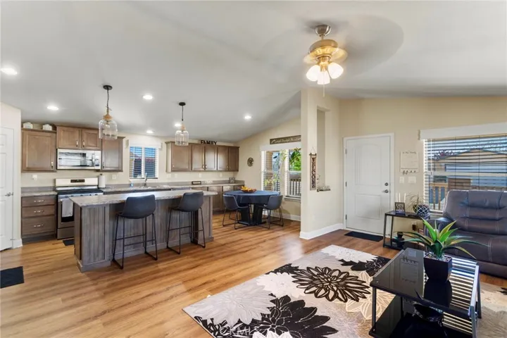Open kitchen with large island flowing into living room.