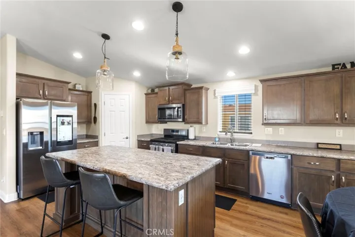 Bright kitchen with island, cabinetry, and modern finishes