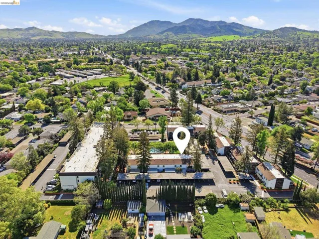 View of property location featuring mountains and nearby suburban area