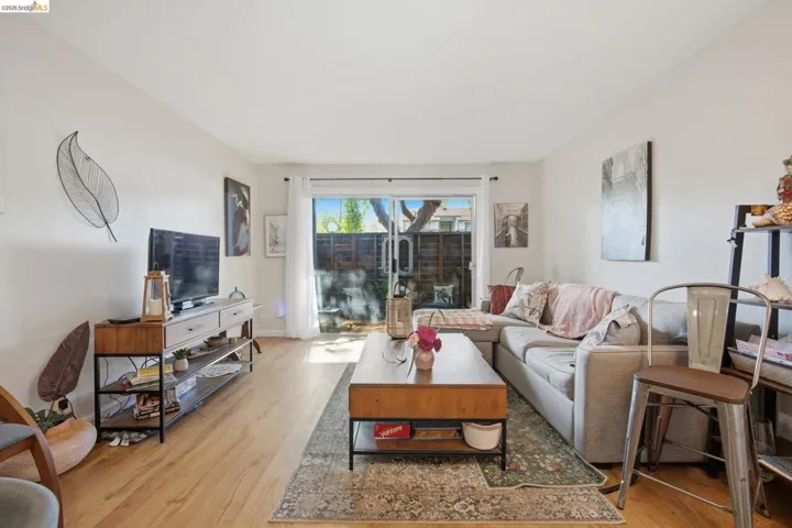 Living area with light wood finished floors