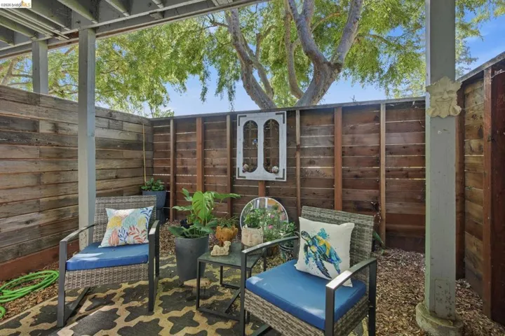 Fenced backyard featuring a patio