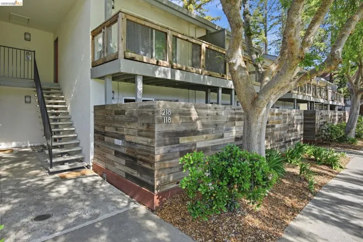 View of property exterior with stairway