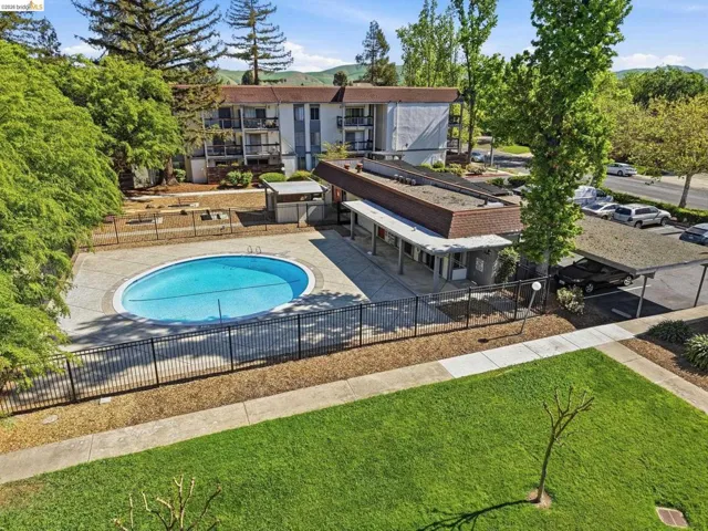 Community pool featuring a patio