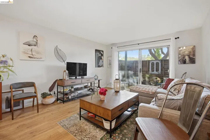 Living area with light wood-type flooring and baseboards