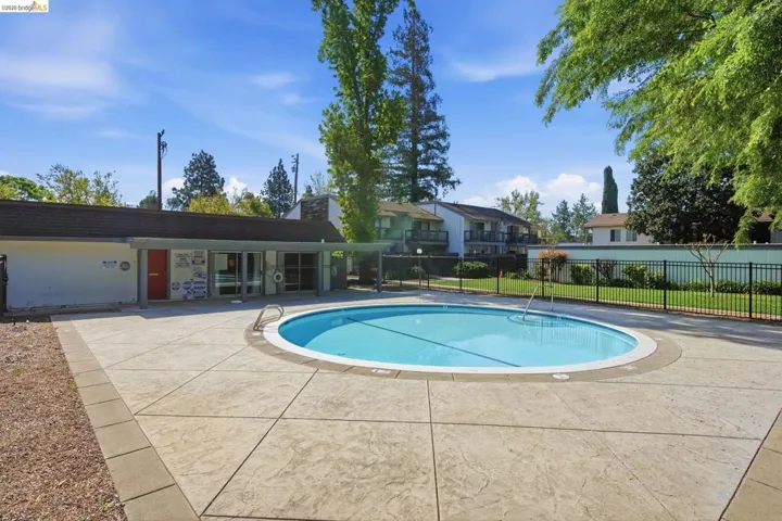 Community pool with a​​‌​​​​‌​​‌‌​​‌​​​‌‌​​​‌​​‌‌​​‌‌​​‌‌​​​​ patio