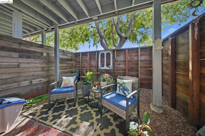 Fenced backyard with a patio