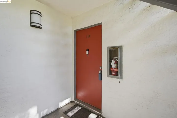 View of exterior entry with stucco siding